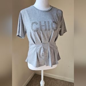 Women use gray top with silver rhinestones with the word CHIC on the front. (M).
